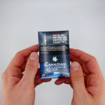 hands holding a pack of Canadian Classics Silver cigarettes