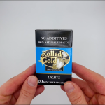 hands holding a pack of Rolled Lights cigarettes