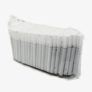 Row of white cigarettes tightly packed in a sealed plastic wrap, standing upright in a rectangular bundle