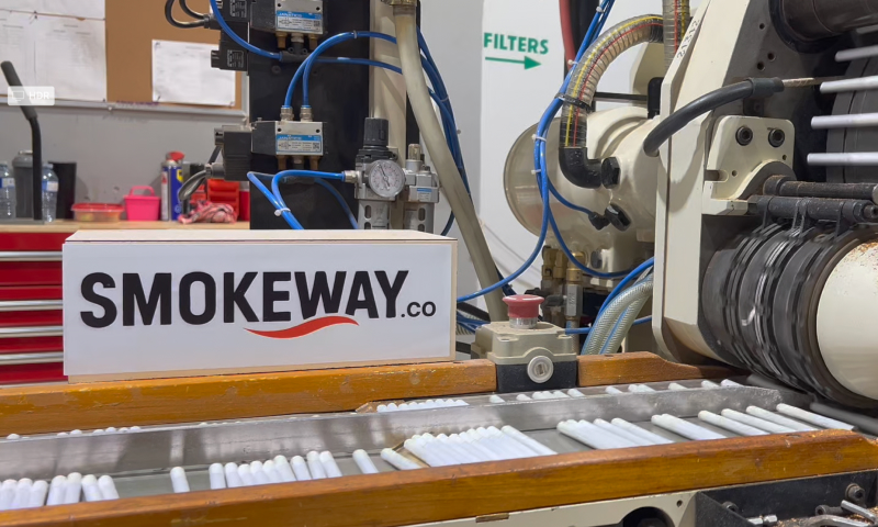 smokeway-factory-manufacturing-process-2 - Smokeway Smokeway factory, crafting process of original native cigarettes, sorting stage, cigarette manufacturing machine with rows of fresh cigarettes